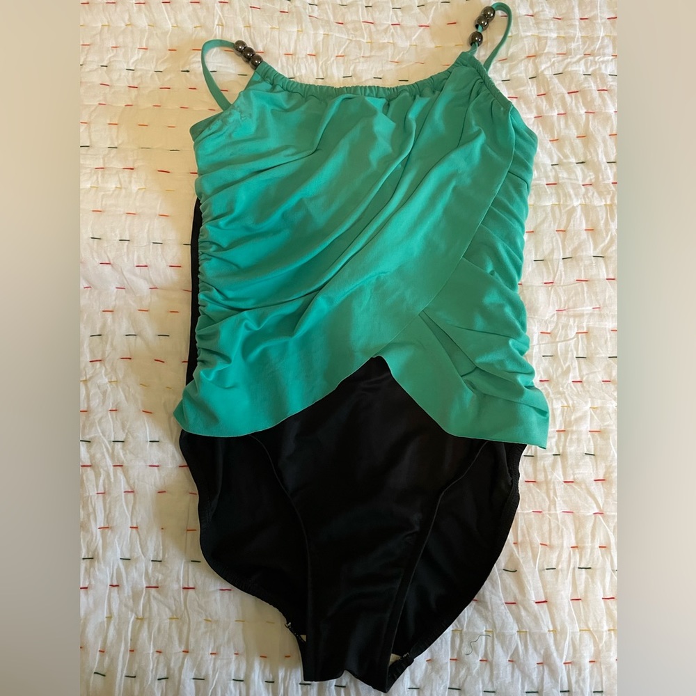 Ladies ‘Magic Suit’ size 12 used  once for a cruise! Lovely Aqua Blue and Black.